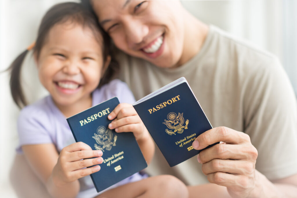mom and child holding passports and sponsoring a child to come to the us, child's birth certificate issued correctly