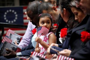 a family of immigrants at a naturalization ceremony.